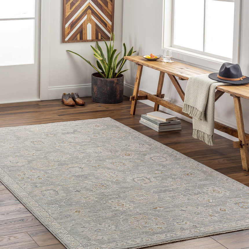 Entryway with a light beige Wurtulla Thick Luxe Statement Rug, wooden bench, and decorative accents. Roomscene-Rectangle