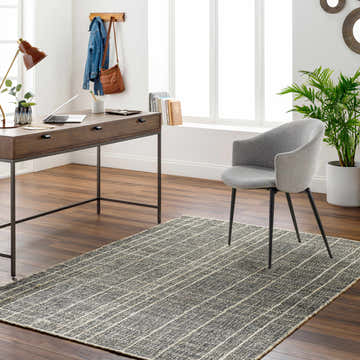 Home office with a gray chair on the dark gray and natural Yeva Area Rug. Roomscene-Rectangle