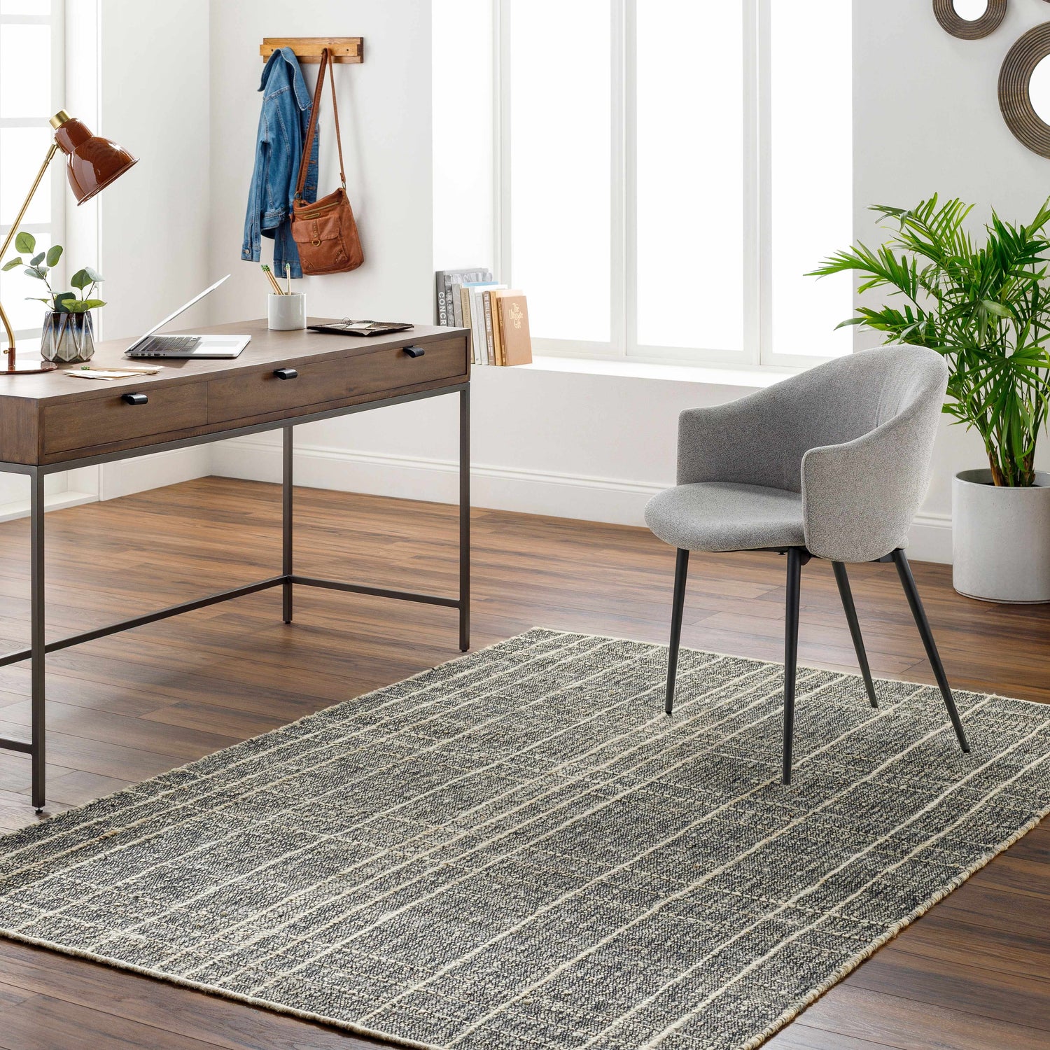 Home office with a gray chair on the dark gray and natural Yeva Area Rug. Roomscene-Rectangle