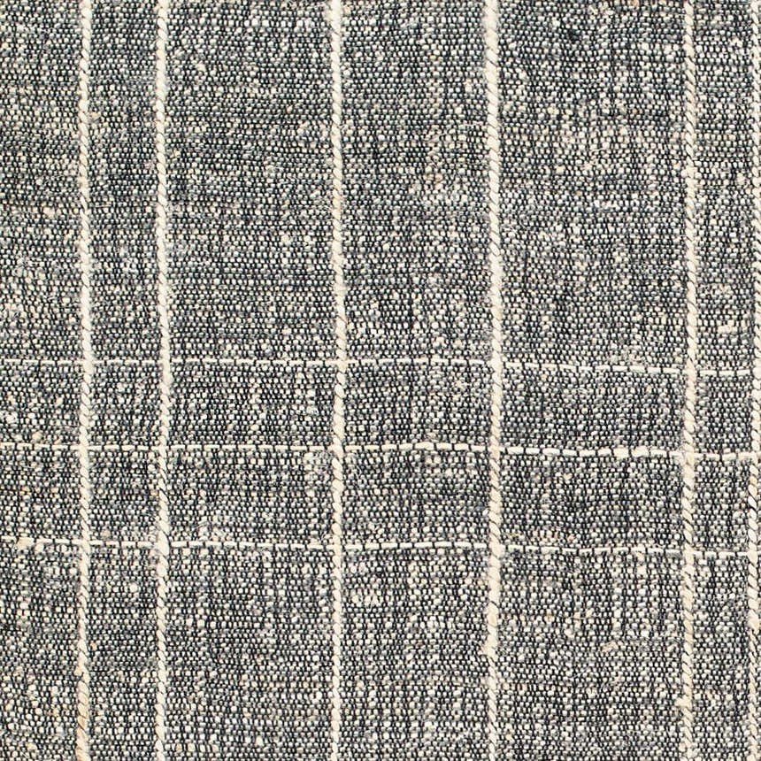 Close-up of the hand woven Yeva Area Rug. Dark gray jute with natural gray stripes create a contemporary plaid pattern. Swatch