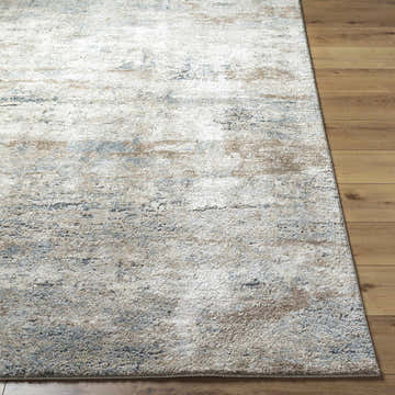 Close-up of the beige, gray, and tan Yoshe Thick Luxe Rug showing its contemporary design and soft, textured pile. Front