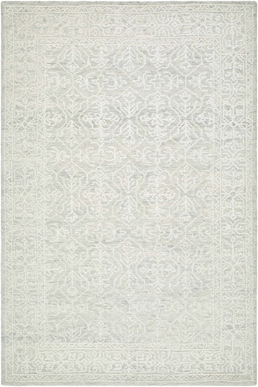 Close-up of the Yadid Sage Wool Area Rug. Hand-tufted wool rug in ash, light silver, and silver gray with a traditional floral pattern. Design-Rectangle-576