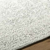 Close-up of the Yadid Gray Wool Area Rug showing its traditional pattern and soft, textured wool. Texture