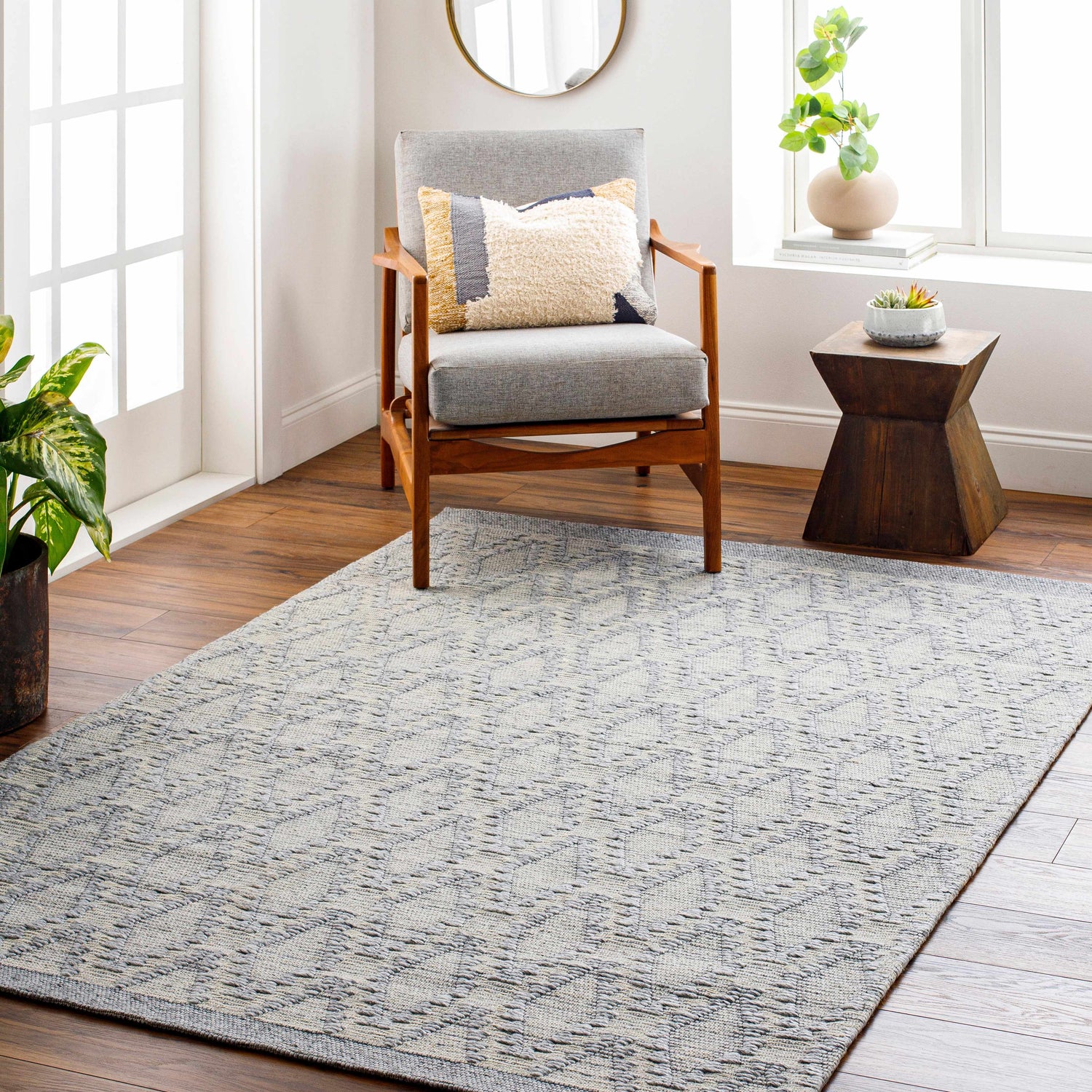Living room scene with a gray chair and the gray Yank Area Rug. Roomscene-Rectangle