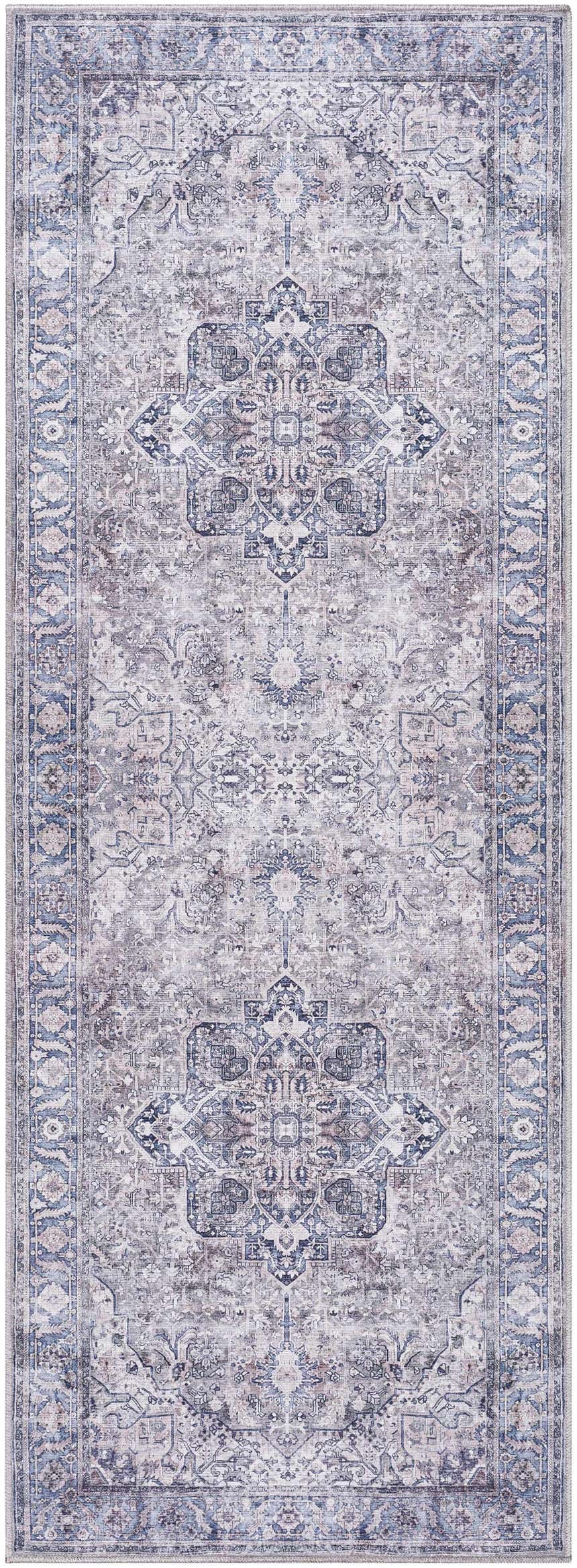 Close-up of the Yoshi Washable Area Rug, featuring a traditional denim, cream, and gray pattern. Design-Runner-2773