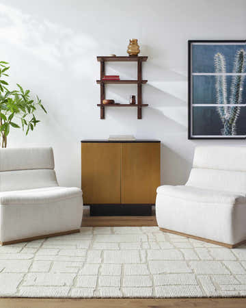 Living room scene with two white chairs and the Yetty Silver Grid Wool Rug. Roomscene-Rectangle