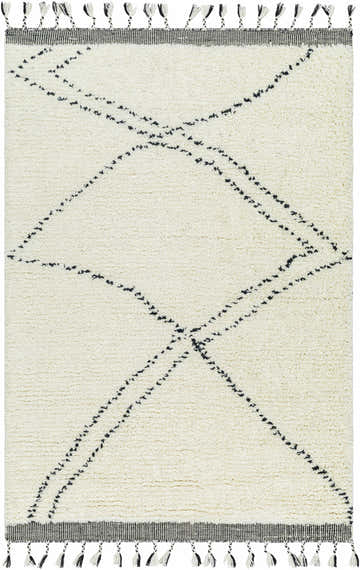 Pearl Yumie Area Rug close-up. Hand-woven wool rug with a geometric black dotted line pattern and black and white tassels. Design-Rectangle-576