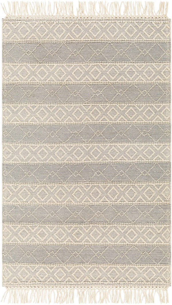 Close-up of Zaza Wool Rug in bone and cloud gray. Hand-woven rug with geometric pattern and tassels. Design-Rectangle-58