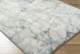 Close-up of the Urowo Light Gray Thick Luxe Rug showing its cream, gray, and light blue contemporary pattern. Corner