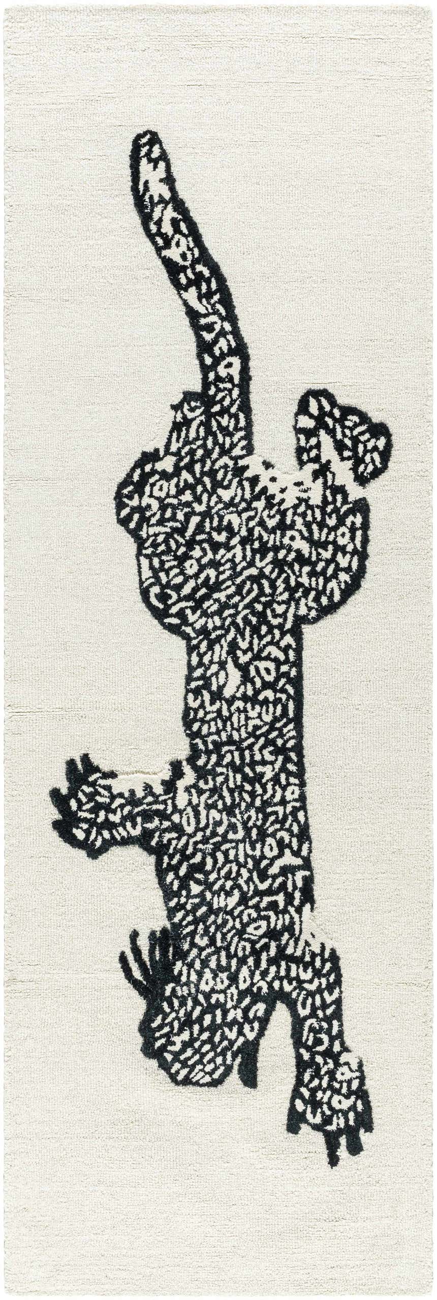 Close-up of the Zosia Area Rug, a hand-tufted wool rug with a black abstract animal design on an off-white background. Design-Runner-268