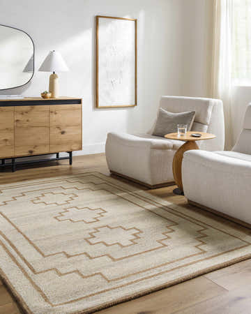 Living room scene with the Ziven Area Rug, two armchairs, and a wooden cabinet. Neutral tones create a calming, transitional space. Roomscene-Rectangle